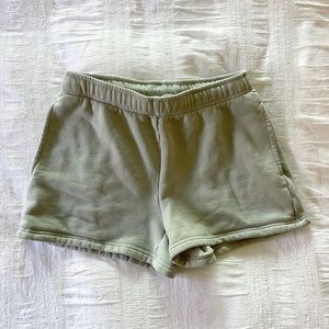 aritzia tna soft cozy fleece sweatshorts in sage green
